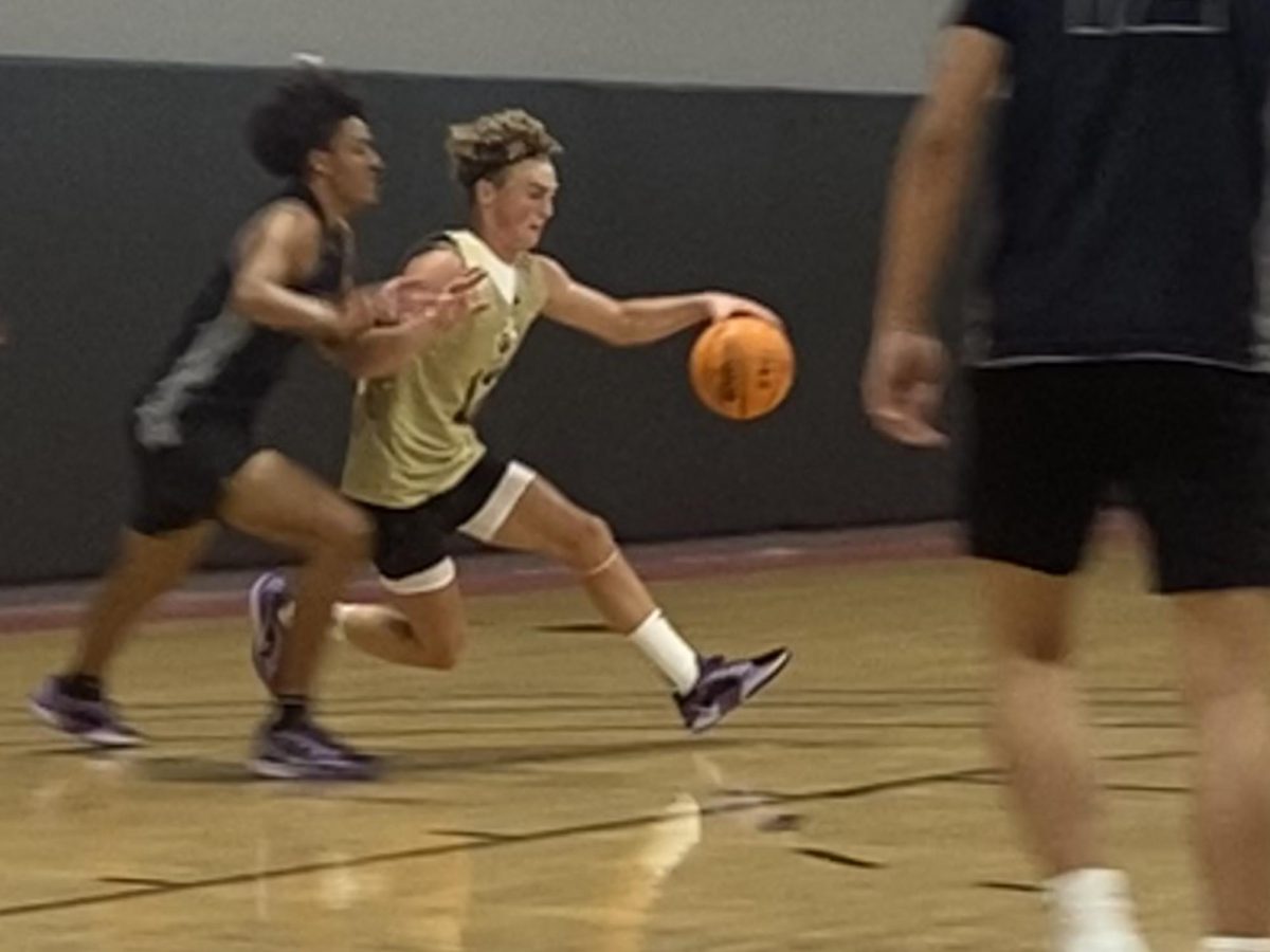 Senior Sean Pendleton dribbling past a defender