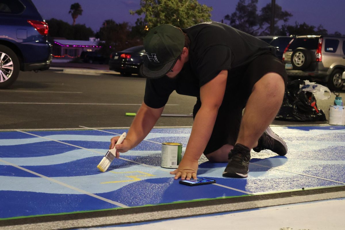 Devin Barrow (12) dialed in on painting his SpongeBob inspired parking spot.