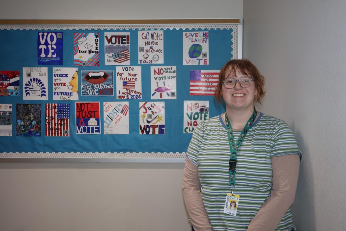 MJ showing off some of her and her classmates artwork.