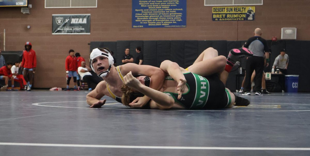 Ryan Francis attempting to pin his opponent. 