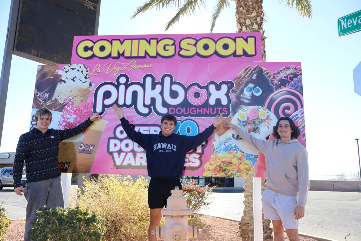 Seniors Tristan Winburn, Eric Torrence and Ethan Valencia posing with the Pinkbox sign. 