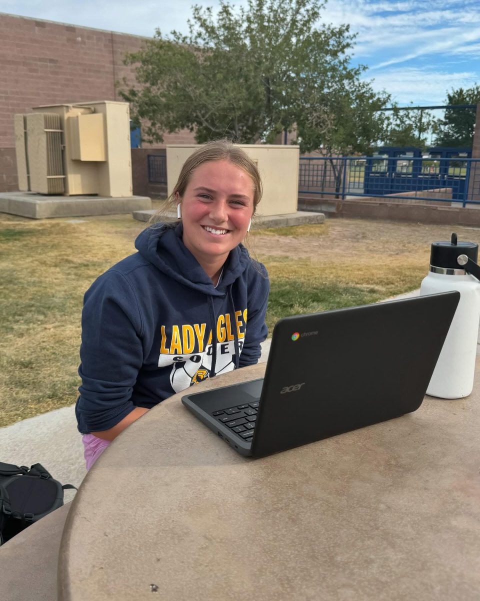 Sophomore Hannah Stark, doing classwork outside. 