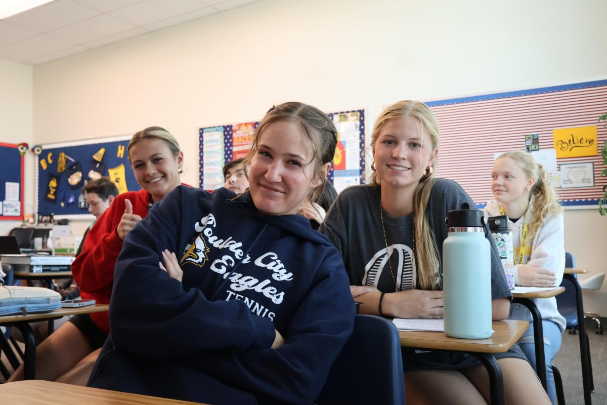 Juniors Mariah Torgesen, Audrey Humes, and Bryelle Young happy to be sitting by each other in history. 