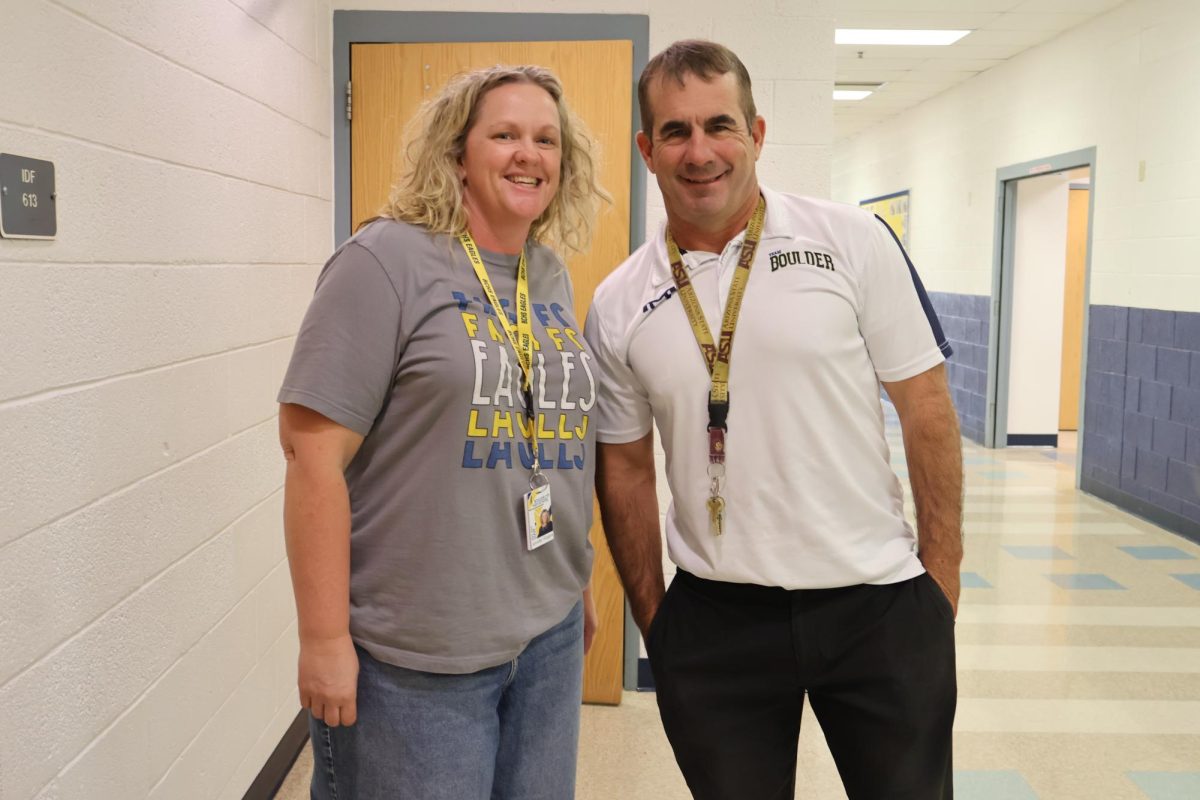 Mrs. Rogers smiling along her science bestie, Mr. Cox. 